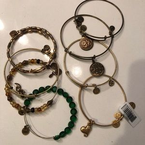 Stack of 8 Alex and Ani bracelets